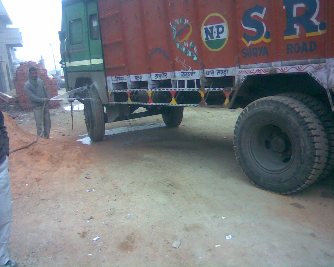 J-Washing Tyres of Mud Truck